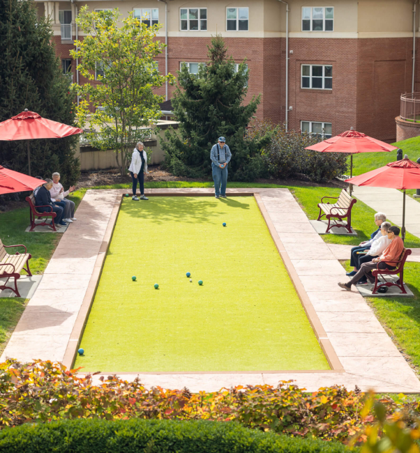 A group of seniors playing bocce ball on a campus for senior living near Ephrata, PA