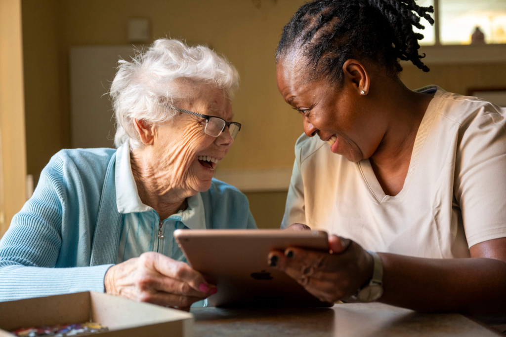 A woman explains the different types of CCRC contracts with a potential resident