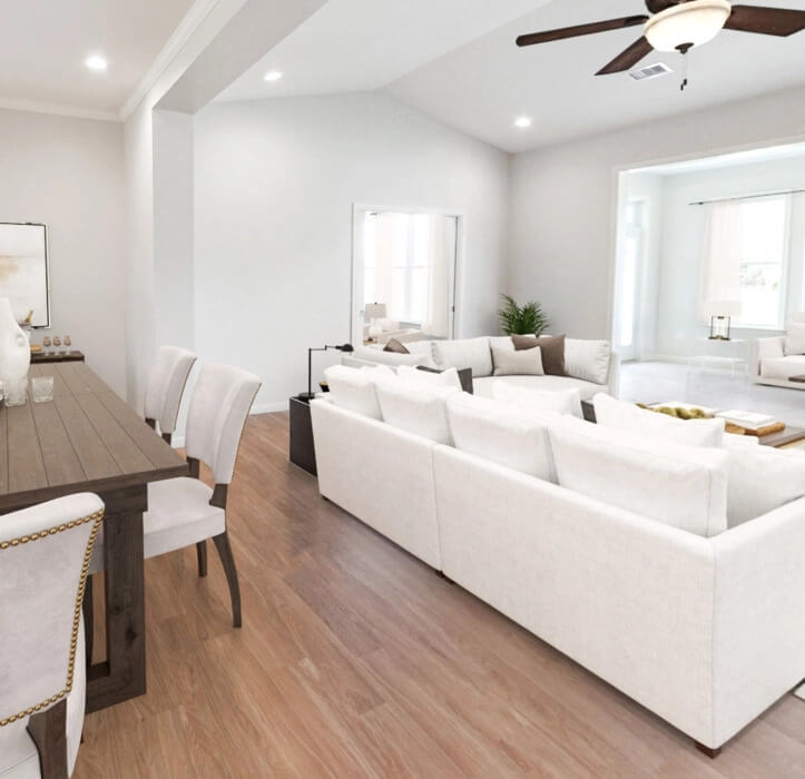 The Bradford Villa with a white couch and a wooden dining table