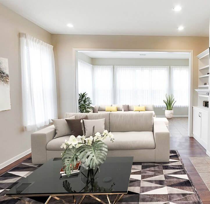 The Cameron Villa with a black coffee table and a gray couch