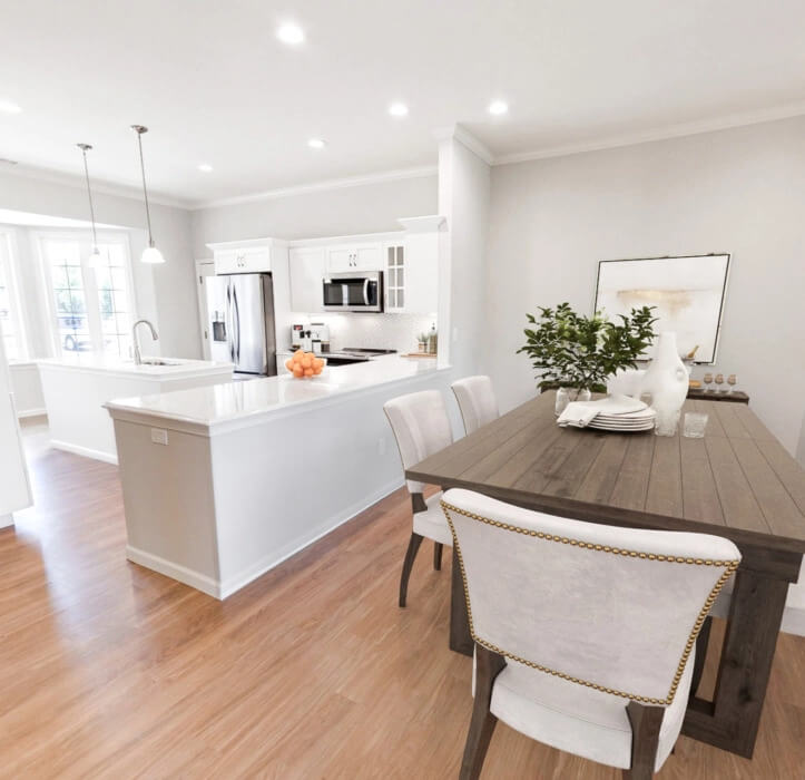 The Dauphin Villa with a wooden dining table and white countertops
