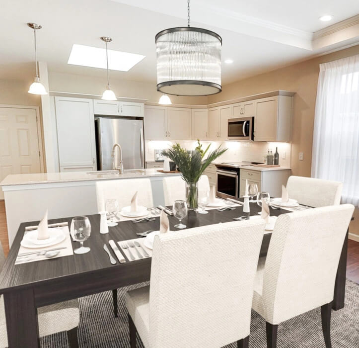 The Erie Villa with a wooden dining table and white countertops