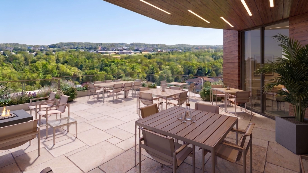 A view of the terrace of Woodcrest Villa's new Goldfinch apartments, looking out over campus