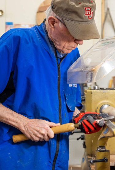 Ron, a resident of a senior independent living facility in Lancaster, PA, uses tools in the woodshop