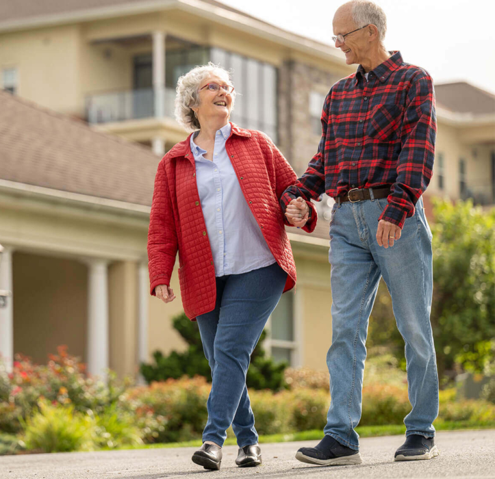 An older couple walks through a retirement community in Lancaster County, PA. They look at each other and smile